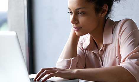 Woman looking at laptop screen